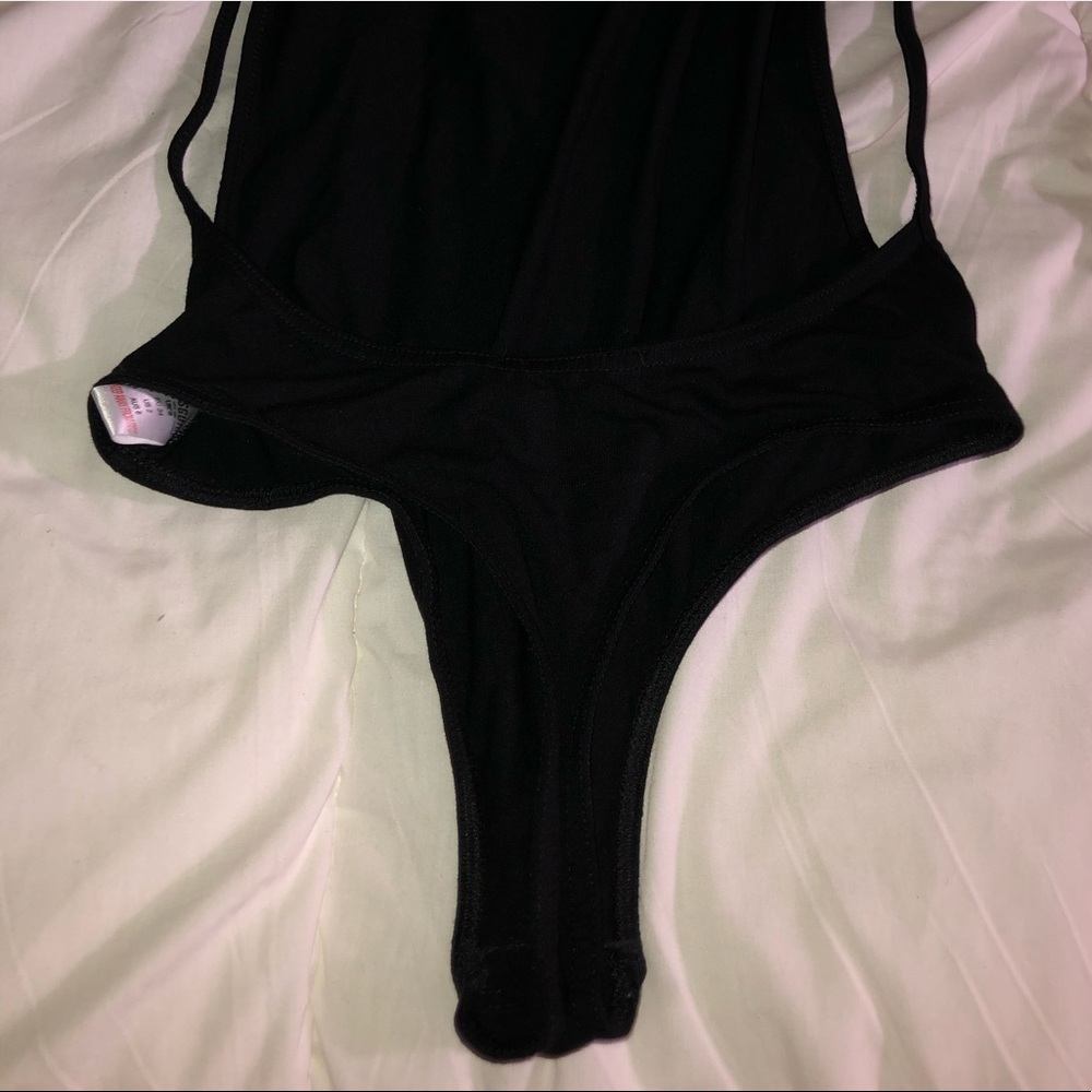 A black backless bodysuit